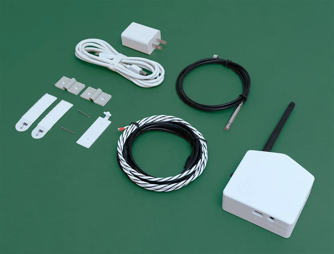 Knolled product photograph of everything in the box, from the sensor to the mounting hardware.